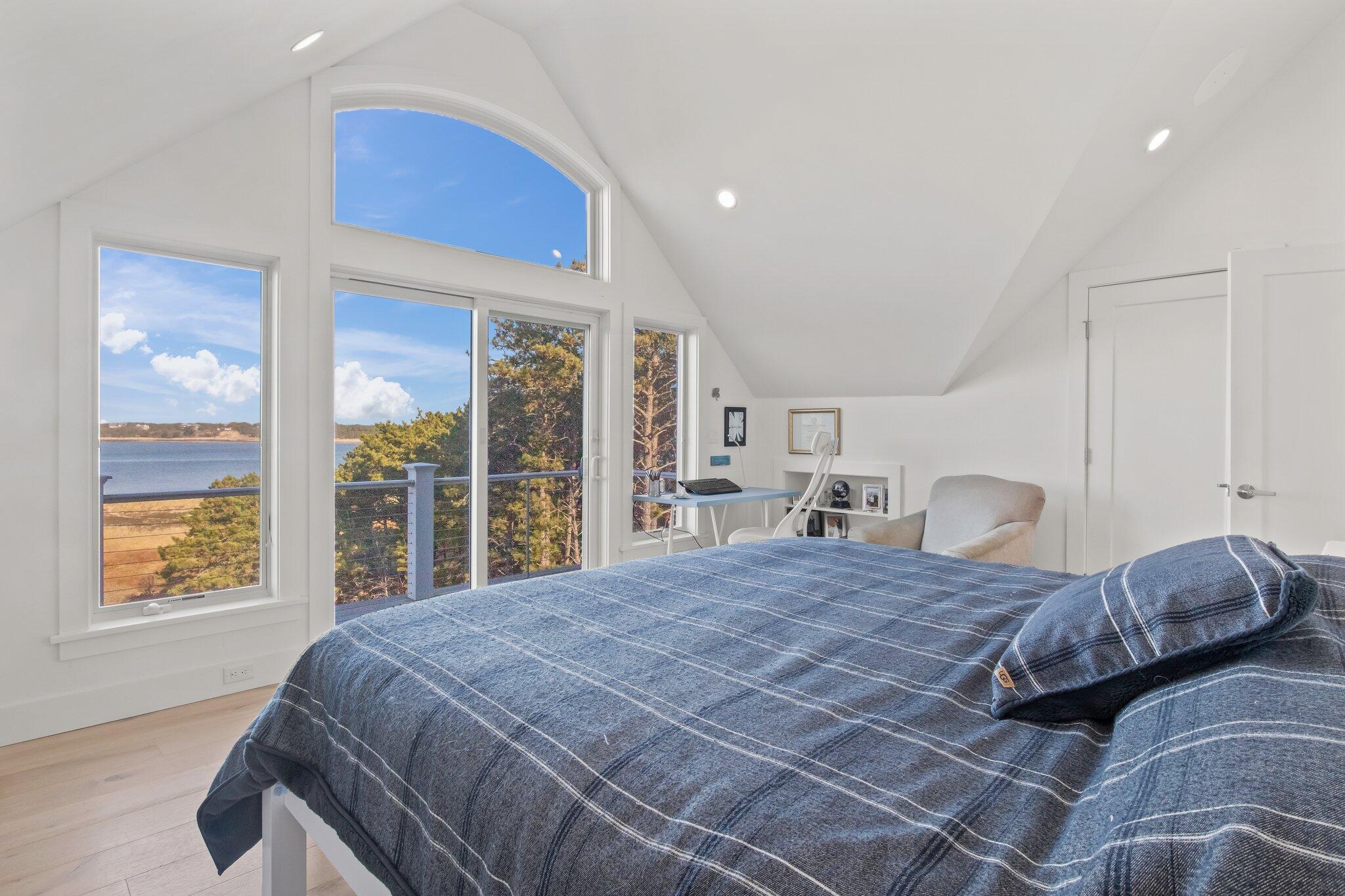 20 4th Avenue Wellfleet, MA 02667 - Photo 32 of 68 a bedroom with a large bed and a large window