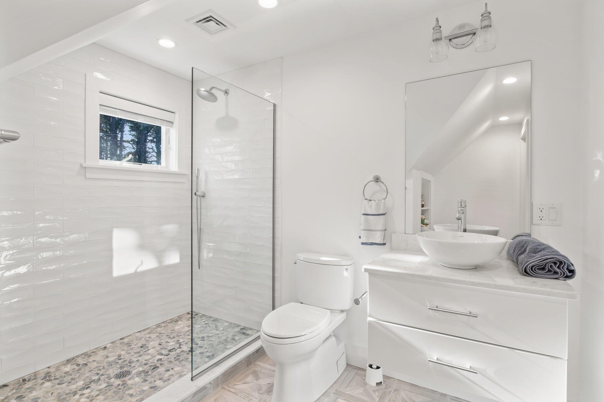 20 4th Avenue Wellfleet, MA 02667 - Photo 35 of 68 a bathroom with a sink toilet and shower