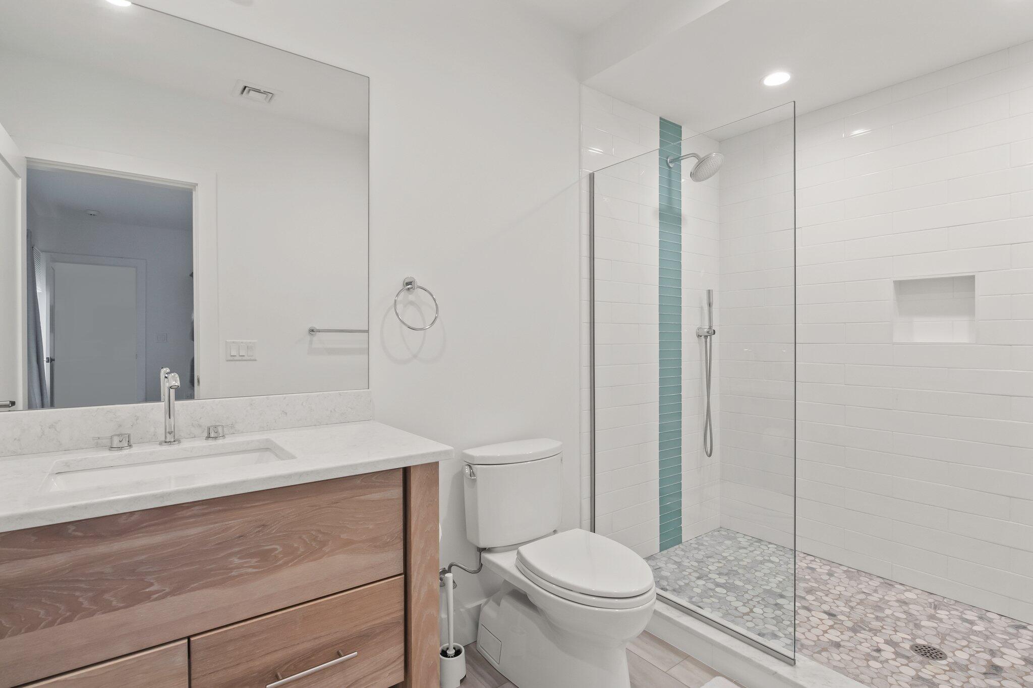 20 4th Avenue Wellfleet, MA 02667 - Photo 44 of 68 a bathroom with a sink a toilet and shower