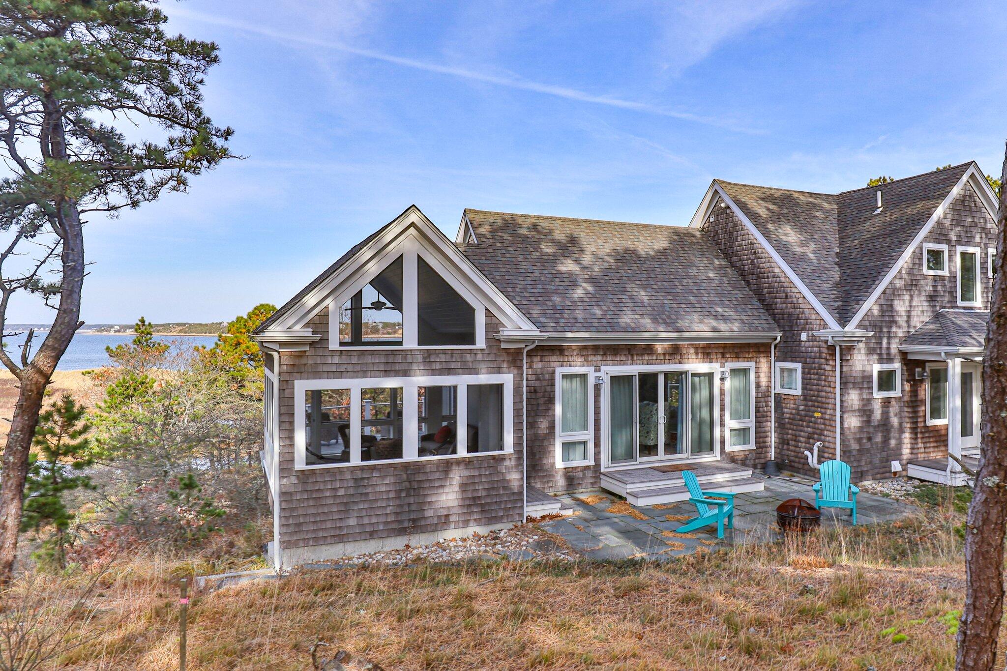 20 4th Avenue Wellfleet, MA 02667 - Photo 5 of 68 a front view of a house with garden