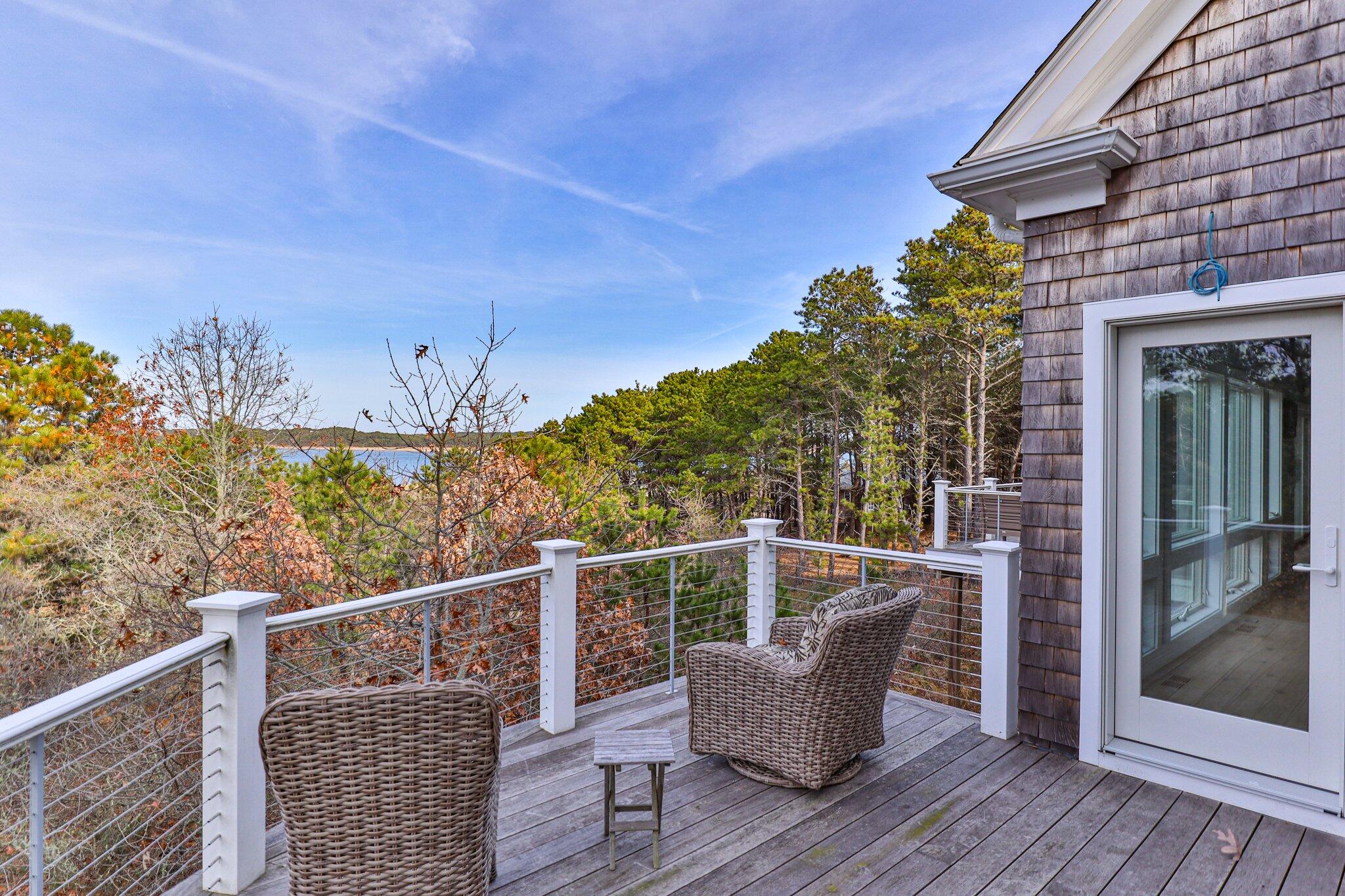 20 4th Avenue Wellfleet, MA 02667 - Photo 52 of 68 a roof deck with wooden floor and fence