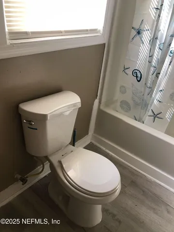 a house with trees in the background