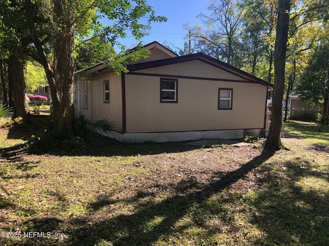 a backyard of a house with lots of green space