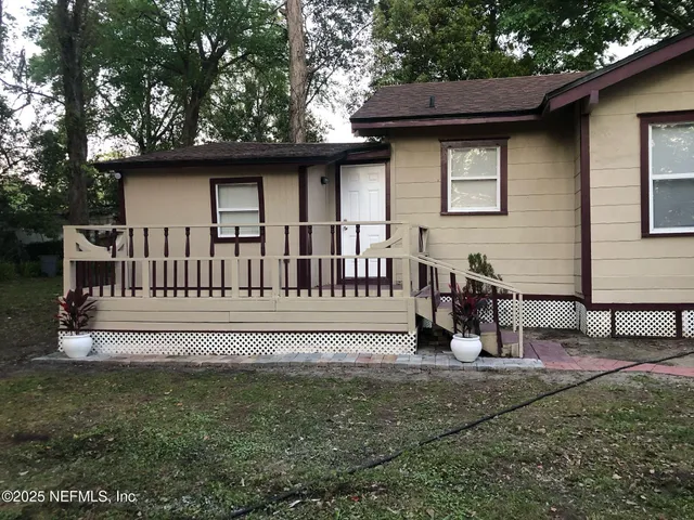 a view of a porch with furniture
