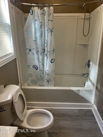 a bathroom with a sink a toilet and a bathtub