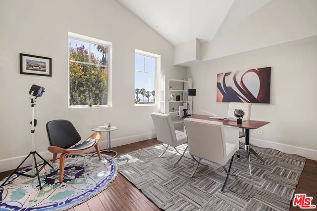a work room with furniture and wooden floor