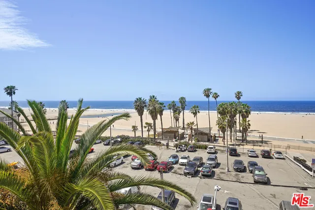 a view of a swimming pool with outdoor seating