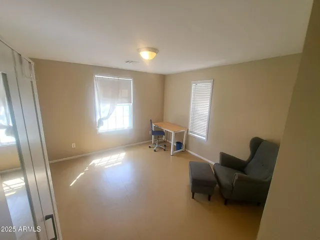 a room with furniture and a window