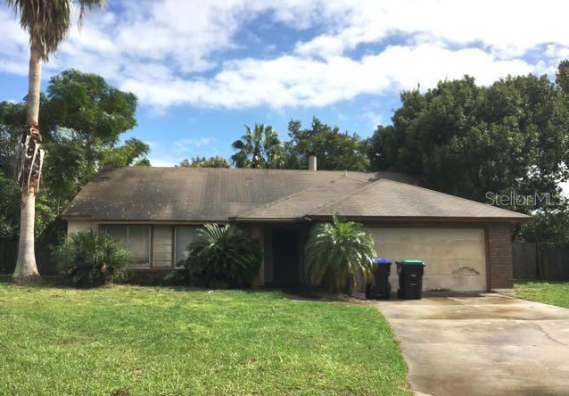 3603 Powers Ridge Court Orlando, FL 32808 - Photo 1 of 1 a view of a yard in front of house