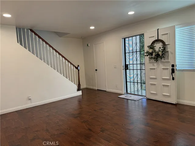 a view of entryway with wooden floor