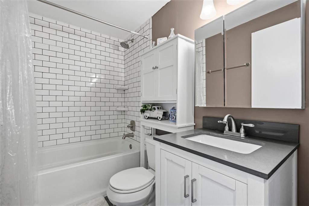 3941 Drexel Road Pittsburgh, PA 15212 - Photo 32 of 49 Updated hall bathroom featuring a relaxing soaking tub.