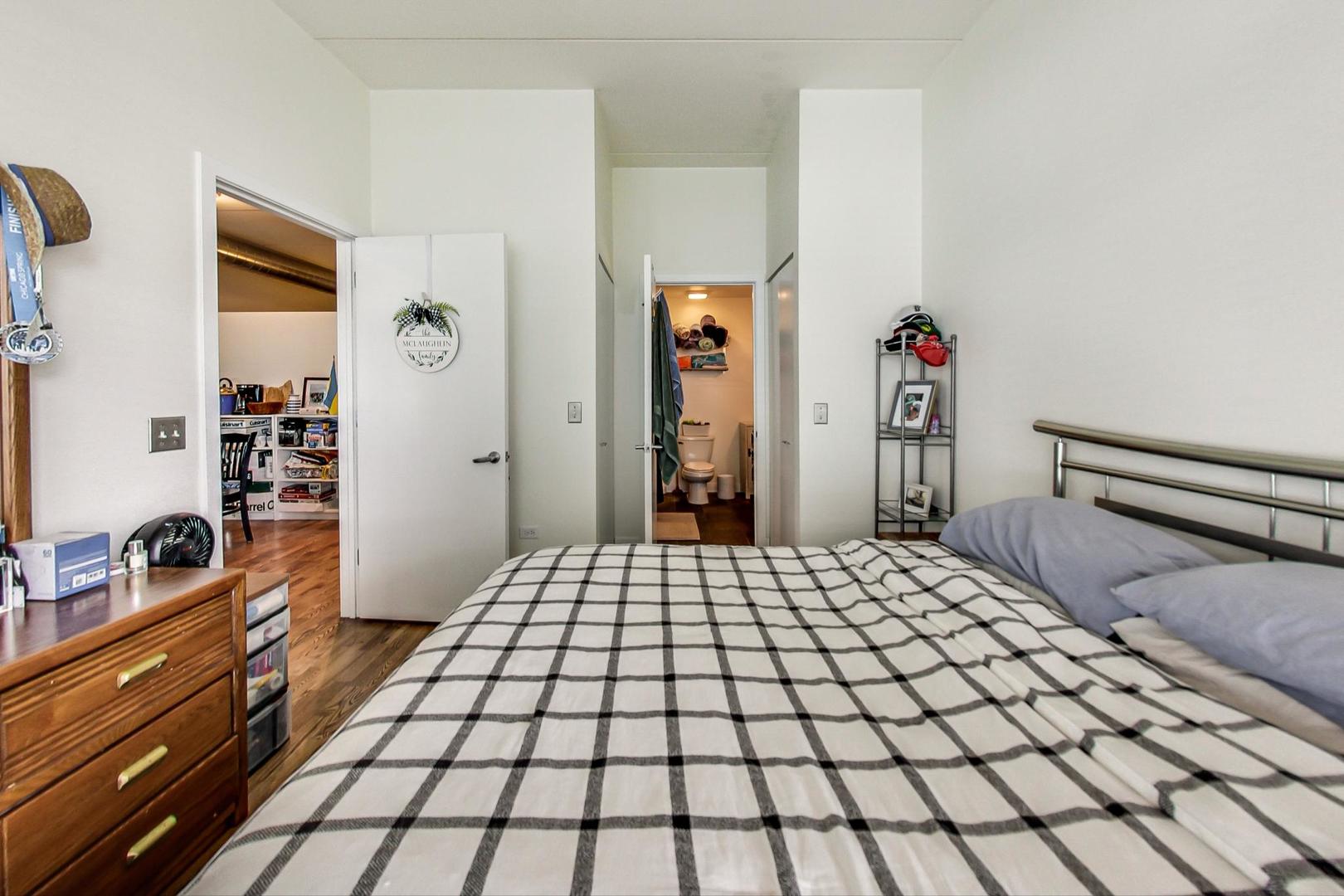 660 West Wayman Street, Unit 603 Chicago, IL 60661 - Photo 11 of 31 a bedroom with a bed and a dresser