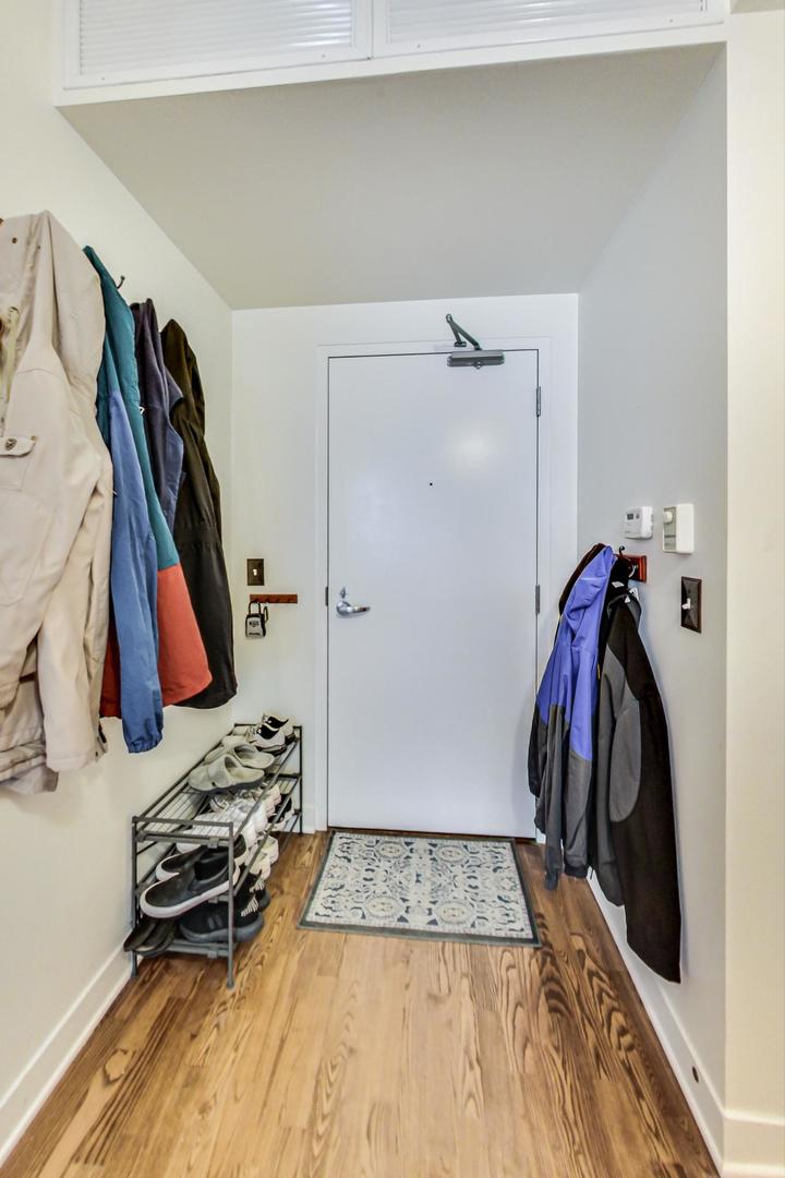 660 West Wayman Street, Unit 603 Chicago, IL 60661 - Photo 18 of 31 a view of walk in closet with clothes and shoes
