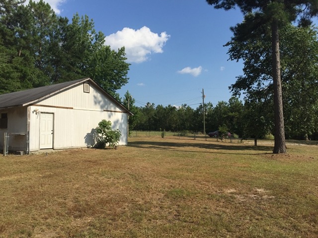 296 Juniper Creek Road Byron, GA 31008 - Photo 1 of 22 a view of large trees with a big yard