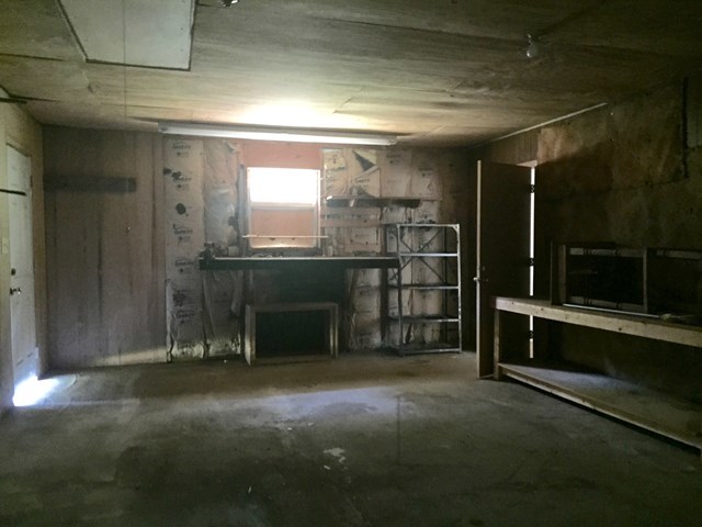 296 Juniper Creek Road Byron, GA 31008 - Photo 14 of 22 a view of a room with wooden shelves