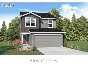 2633 U Street Springfield, OR 97477 - Photo 1 of 15 a front view of a house with a yard and garage