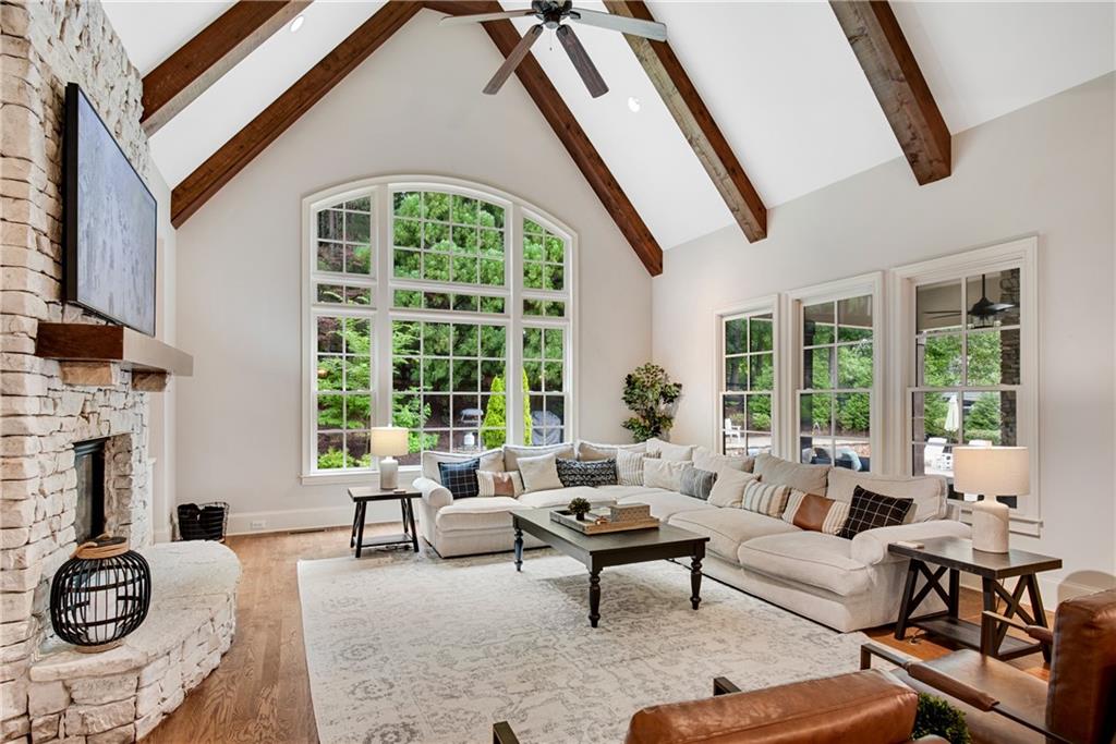 13942 Tree Loft Road Milton, GA 30004 - Photo 24 of 102 a living room with furniture and a large window
