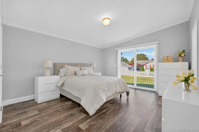 a bedroom with a bed and a table