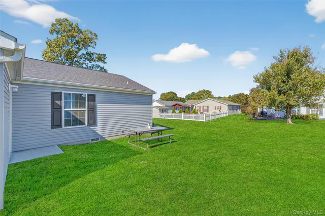 a view of an house with backyard space and garden