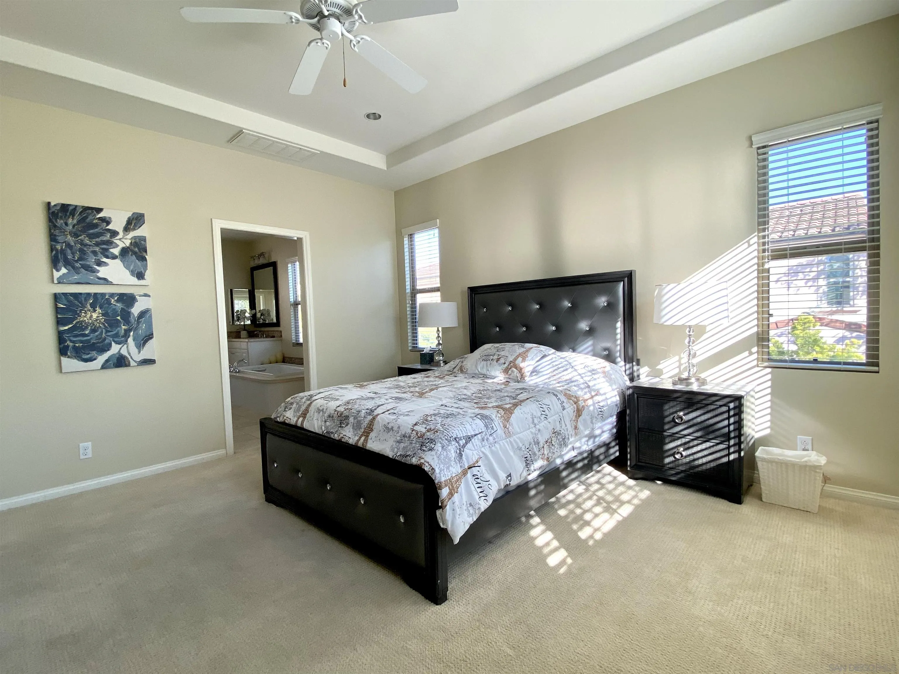 45 Diamond Irvine, CA 92620 - Photo 11 of 16 a bedroom with a large bed and a chandelier
