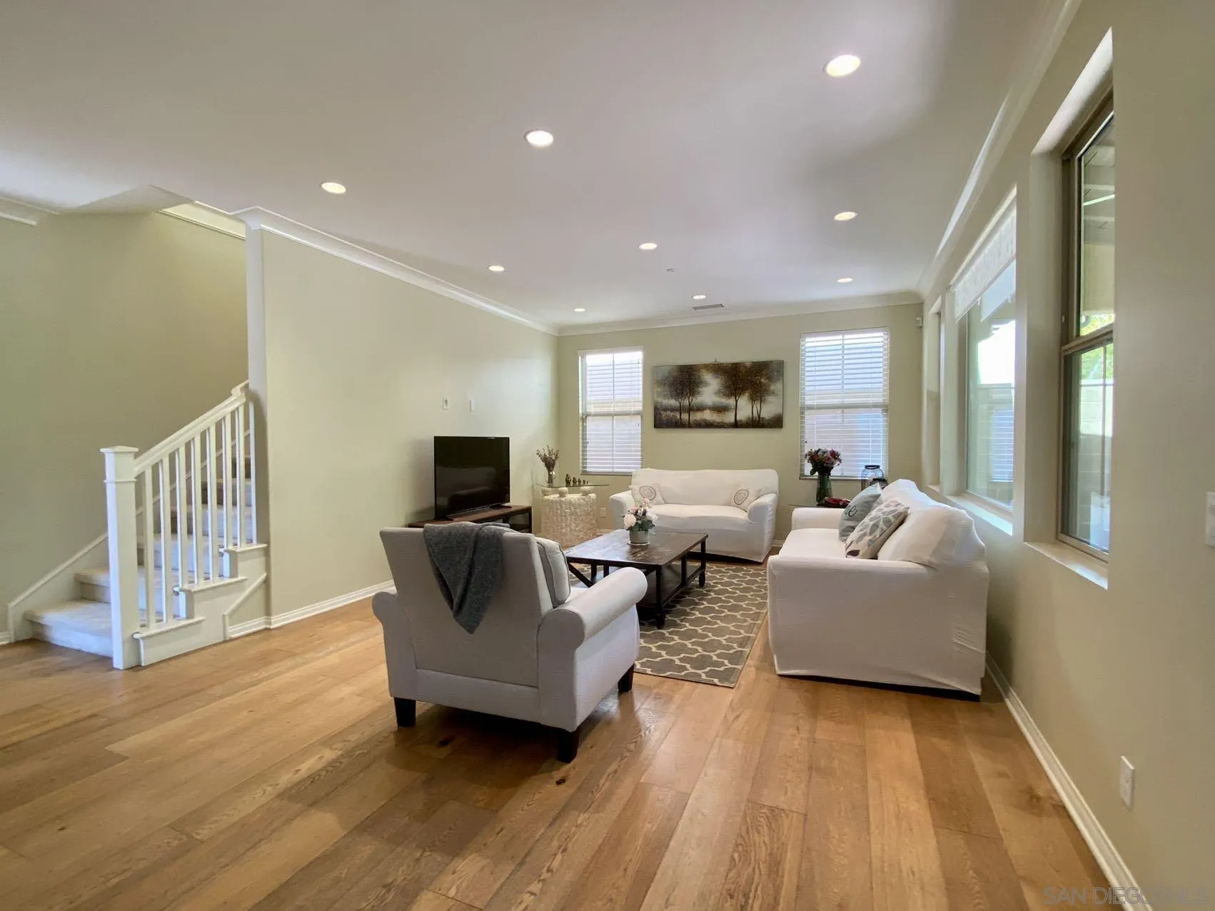 45 Diamond Irvine, CA 92620 - Photo 5 of 16 a living room with furniture and a flat screen tv