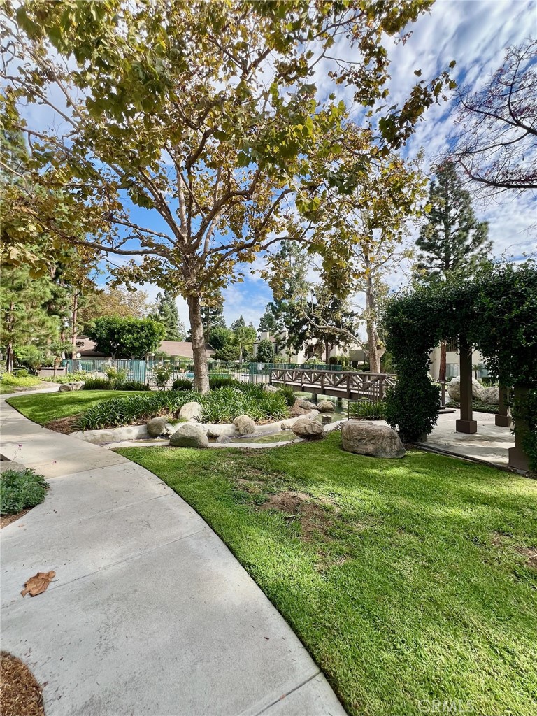 1350 Cabrillo Park Drive, Unit F Santa Ana, CA 92701 - Photo 1 of 32 a view of a park with large trees