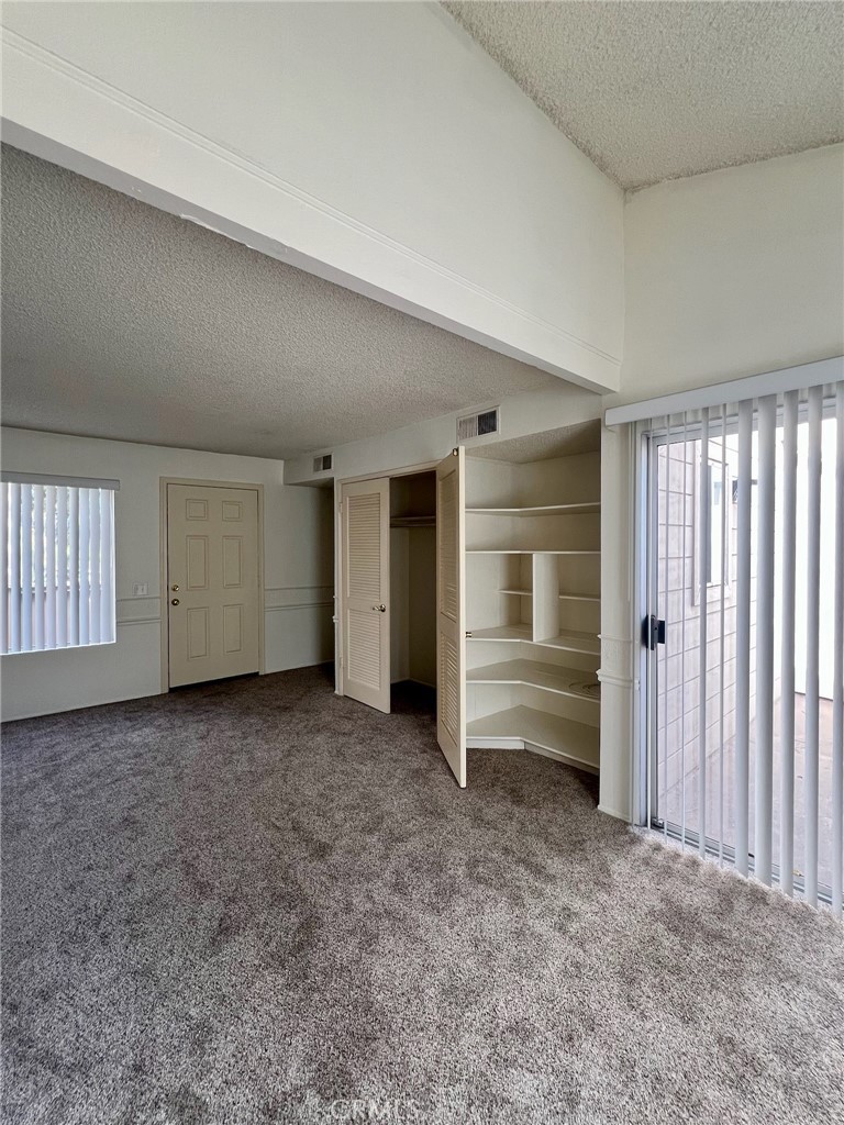 1350 Cabrillo Park Drive, Unit F Santa Ana, CA 92701 - Photo 15 of 32 an empty room with closet and natural light