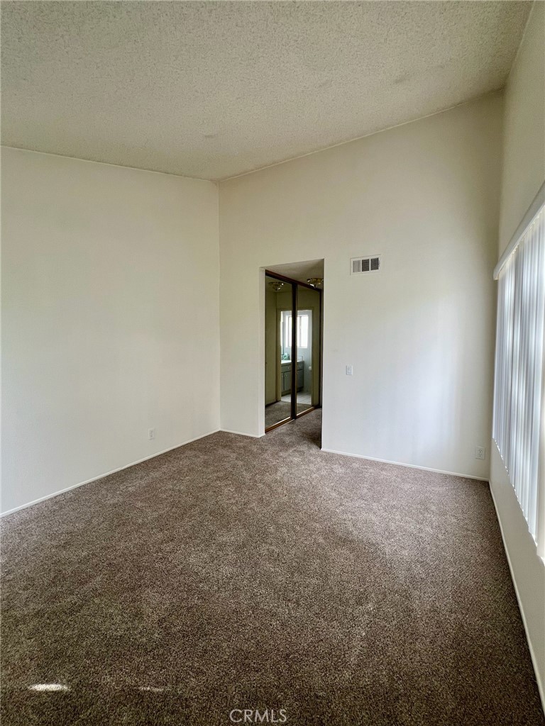 1350 Cabrillo Park Drive, Unit F Santa Ana, CA 92701 - Photo 17 of 32 an empty room with window