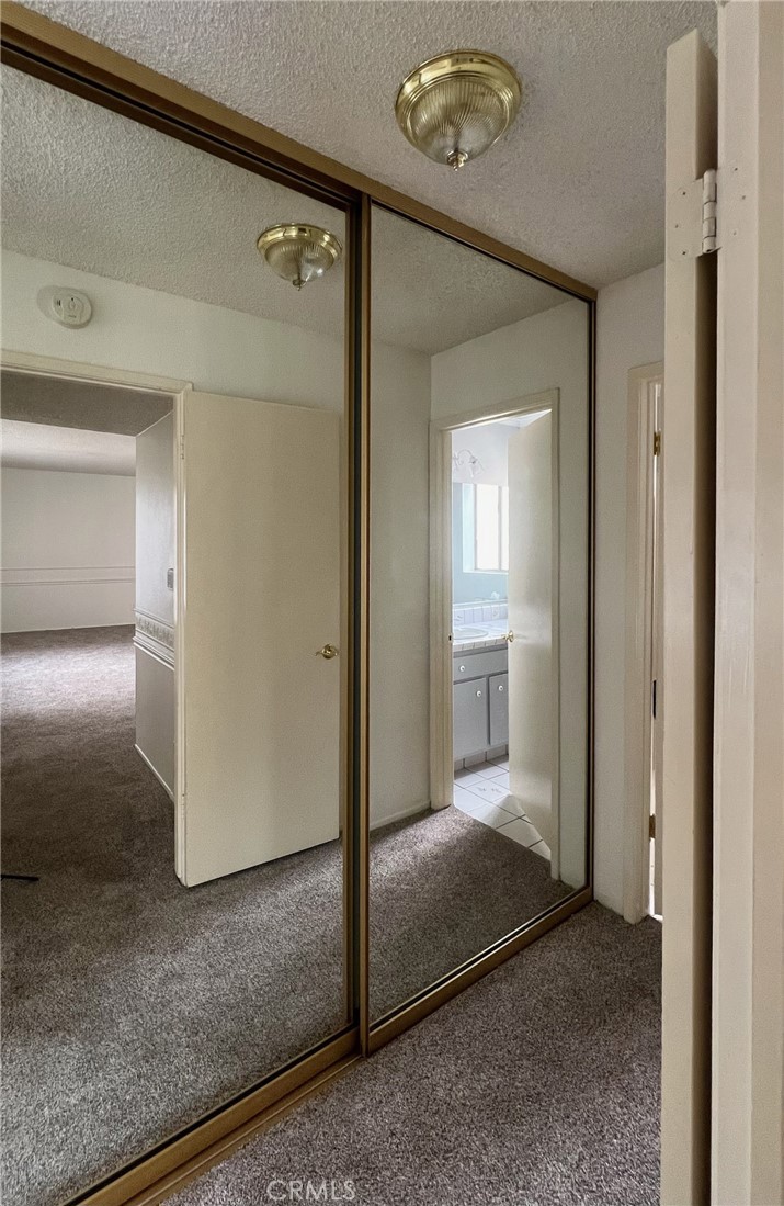 1350 Cabrillo Park Drive, Unit F Santa Ana, CA 92701 - Photo 18 of 32 a view of a hallway with wooden floor