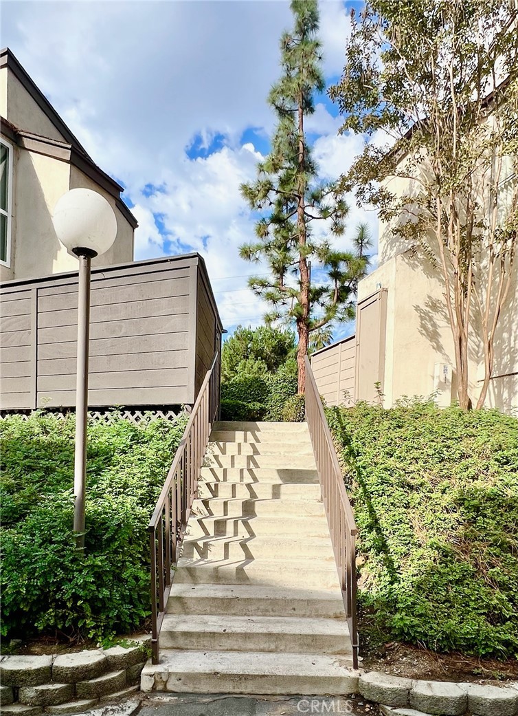 1350 Cabrillo Park Drive, Unit F Santa Ana, CA 92701 - Photo 2 of 32 a view of a yard front of house