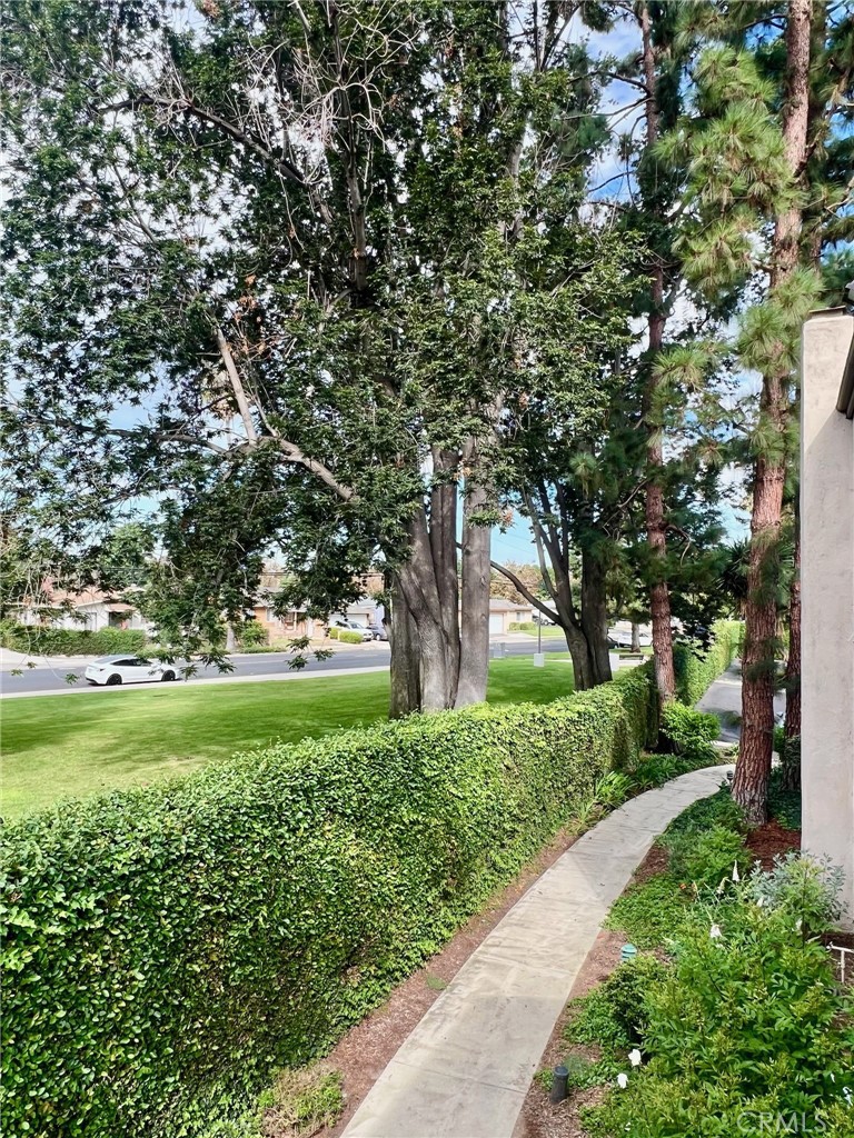 1350 Cabrillo Park Drive, Unit F Santa Ana, CA 92701 - Photo 24 of 32 a view of a garden with an trees