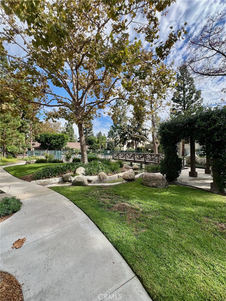 1350 Cabrillo Park Drive, Unit F Santa Ana, CA 92701 - Photo 26 of 32 a view of a park that has a large tree