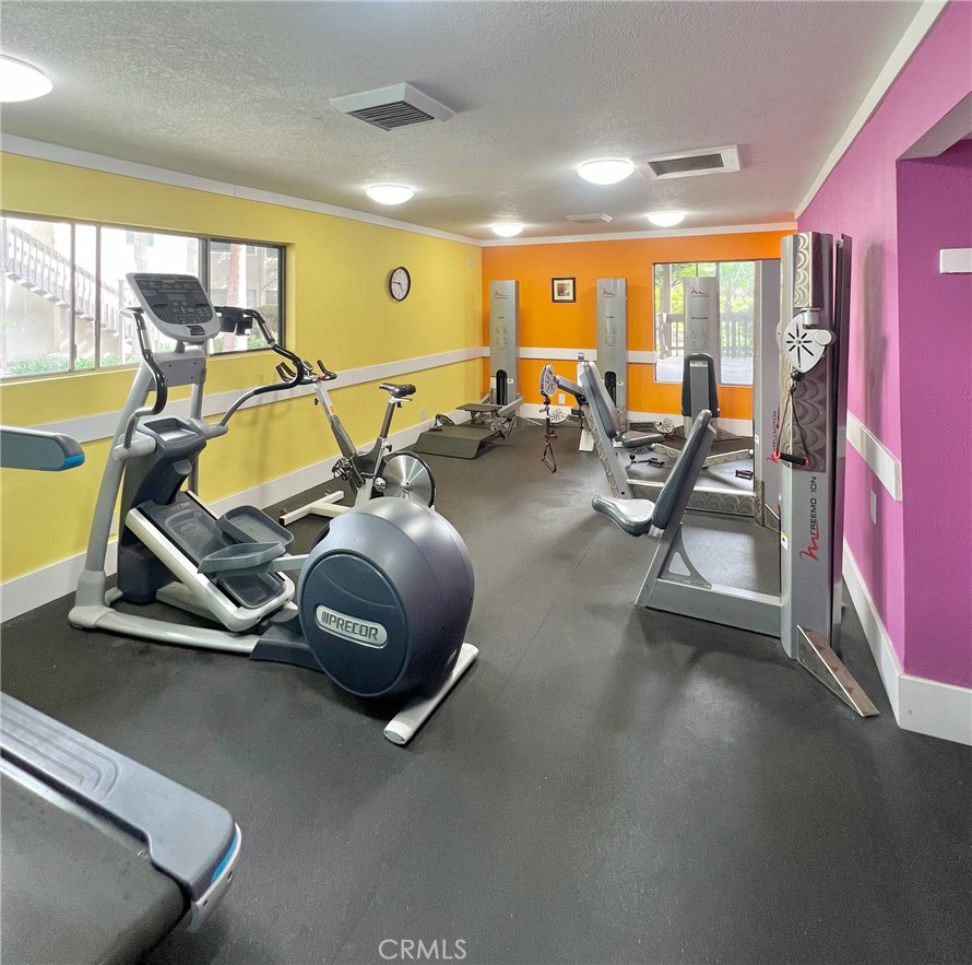 1350 Cabrillo Park Drive, Unit F Santa Ana, CA 92701 - Photo 29 of 32 a view of a room with gym equipment