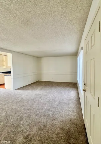 a kitchen with sink window and cabinets