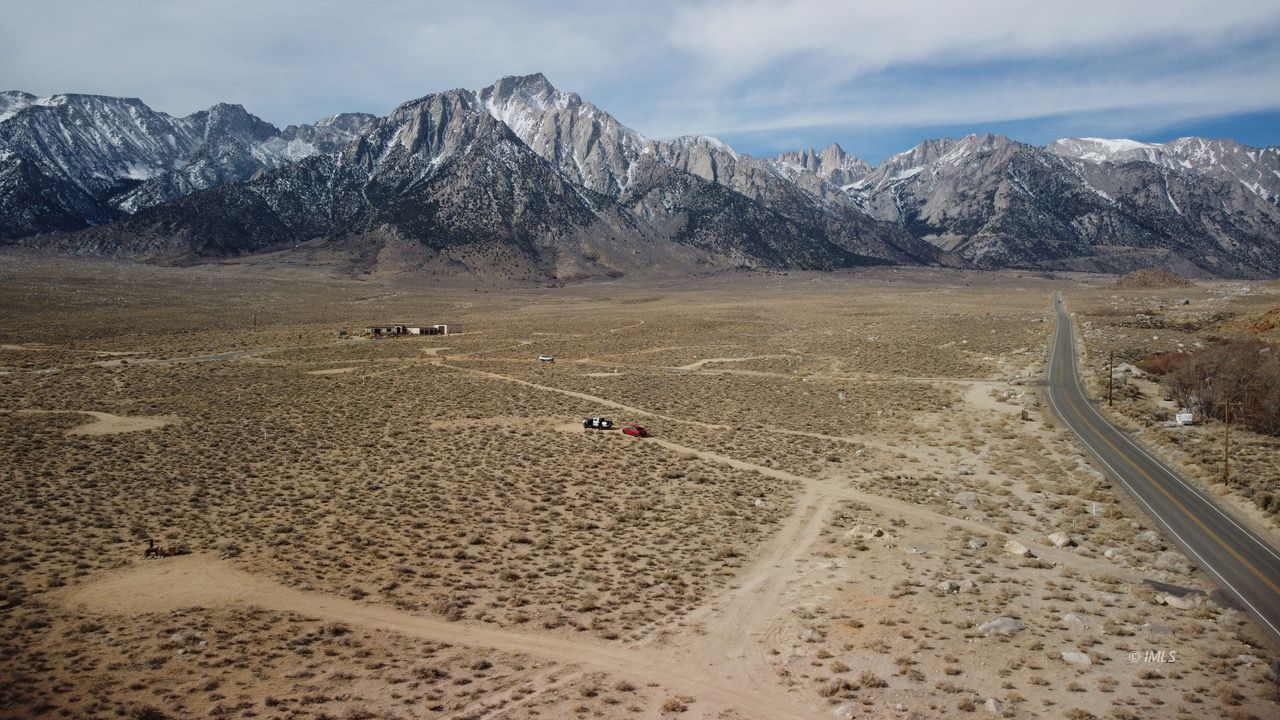 3780 Whitney Portal Road Lone Pine, CA 93545 - Photo 2 of 27 a view of a dry yard with mountains in the background