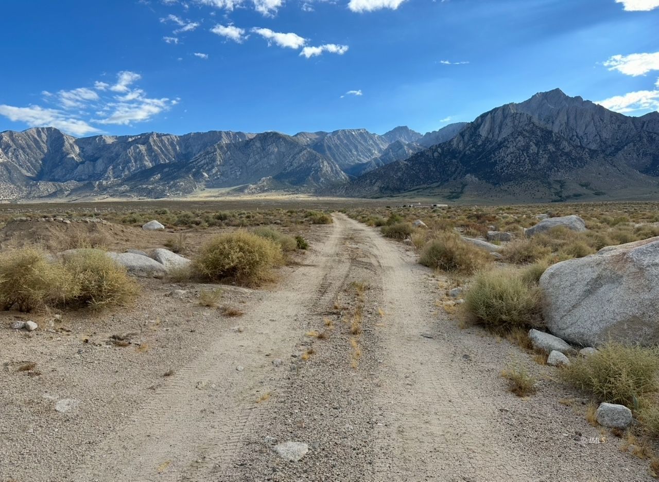 3780 Whitney Portal Road Lone Pine, CA 93545 - Photo 21 of 27 a view of a lake with green field