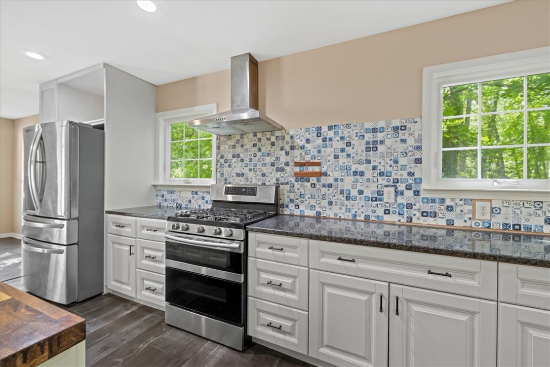 210 Briarcliff Road Central, SC 29630 - Photo 11 of 39 This modern kitchen features stylish finishes and ample space for culinary endeavors.