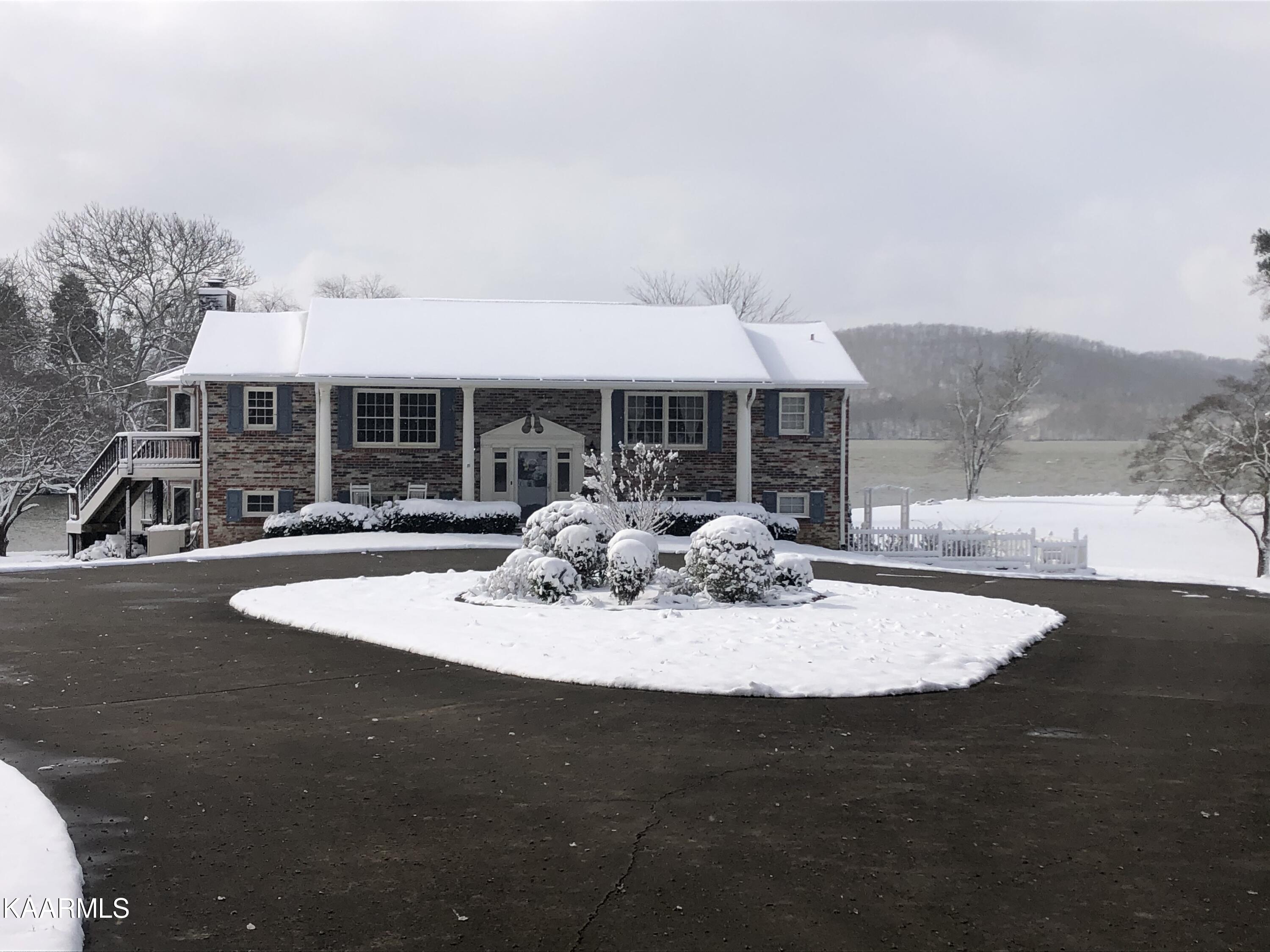 341 Green Acres Road Kingston, TN 37763 - Photo 2 of 57 Front house winter snow
