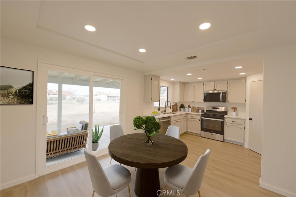 11724 Jamacha Road Apple Valley, CA 92308 - Photo 5 of 25 Dining Area (Disclaimer: Some images have been digitally enhanced with virtual staging to illustrate potential room layouts and furnishings. Actual property condition and features may vary. Buyer to verify all information independently).