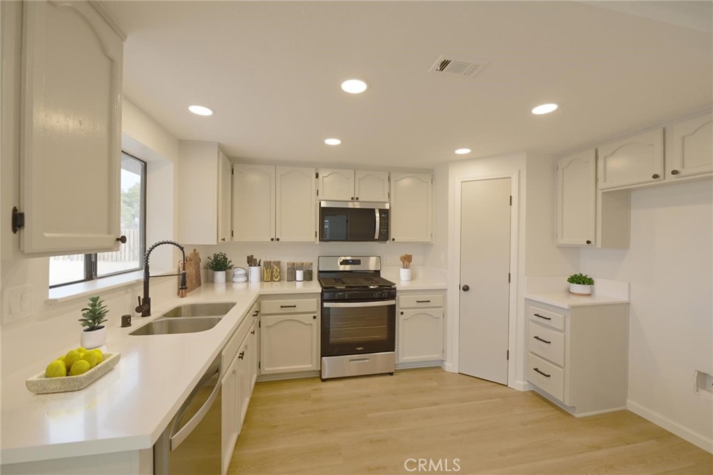 11724 Jamacha Road Apple Valley, CA 92308 - Photo 7 of 25 Kitchen (Disclaimer: Some images have been digitally enhanced with virtual staging to illustrate potential room layouts and furnishings. Actual property condition and features may vary. Buyer to verify all information independently).