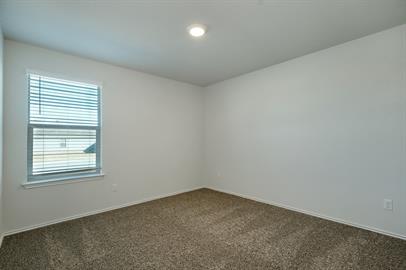 720 Taggart Trail Jarrell, TX 76537 - Photo 4 of 12 an empty room with a window