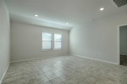 720 Taggart Trail Jarrell, TX 76537 - Photo 7 of 12 an empty room with a empty space and windows