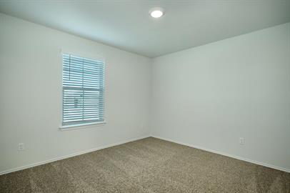720 Taggart Trail Jarrell, TX 76537 - Photo 9 of 12 an empty room with a window