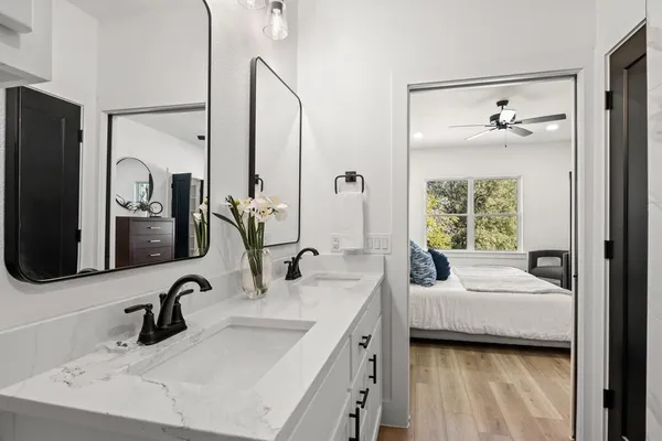 a view of a bathroom from a hallway