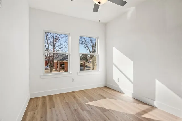 a view of wooden floor in an empty room