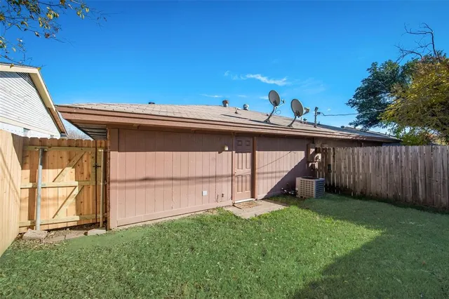 a view of a backyard with a cabin