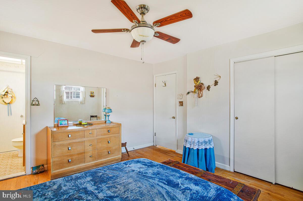 612 Fairmount Road Linthicum Heights, MD 21090 - Photo 20 of 46 a bedroom with a bed and a dresser in it