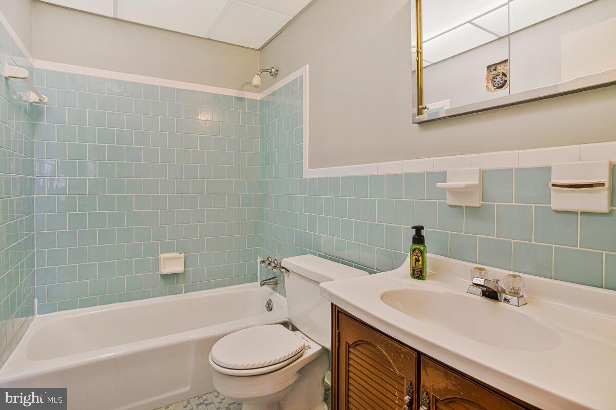 612 Fairmount Road Linthicum Heights, MD 21090 - Photo 25 of 46 a bathroom with a sink a toilet and shower