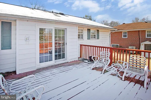 a view of a house with wooden deck