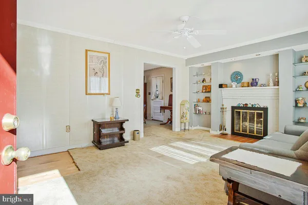 a bedroom with furniture and a fireplace